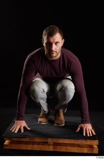 Anatoly  1 brown shoes dressed grey trousers kneeling sweatshirt…